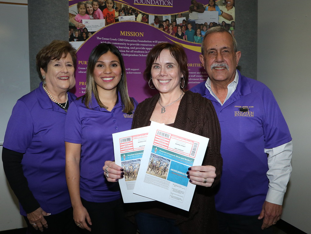 
Brooke Miller (second from right) shows off the two luxury suite tickets for George Strait’s sold out show at the Houston Livestock Show and Rodeo she won in the recent Goose Creek CISD Education Foundation raffle. More than $10,000 was raised to benefit the Goose Creek CISD Education Foundation. Also pictured are Education Foundation board members (from left) Sandra Bell; Erika Foster, director and Mike Wilson. The show is Sunday, March 17, featuring George Strait, Lyle Lovett and special guest Robert Earl.
