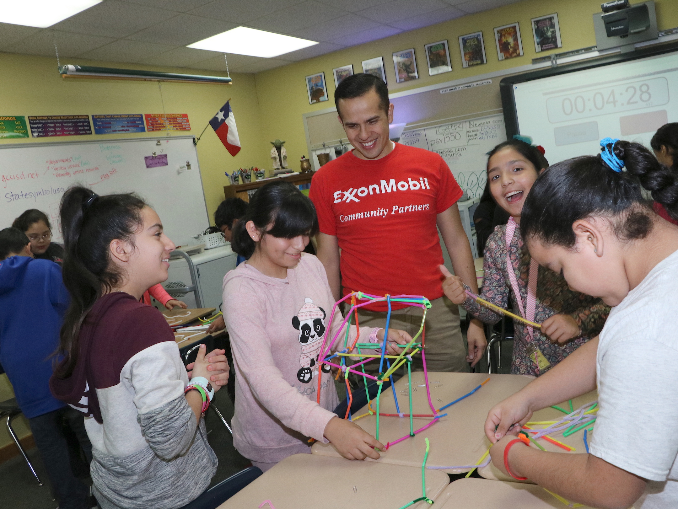 
Jose Mojica (middle) from ExxonMobil, works with San Jacinto Elementary students (from left) Janey Hidalgo, Esmeralda Ibañez, Citlally Mendoza and Alexa Manzo to build a strong structure. ExxonMobil’s Global Organization for the Advancement of Latinos (GOAL) partnered with SJE to provide STEM activities for fourth- and fifth-graders.
