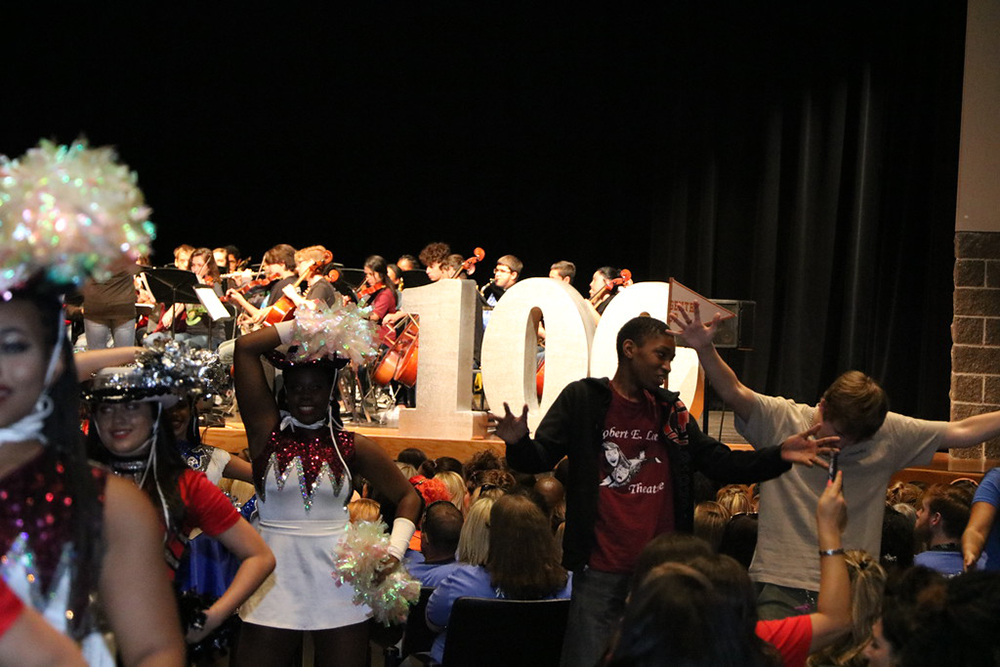 
Combined theatre, drill team, orchestra, band and choir students from Goose Creek Memorial, Robert E. Lee and Ross S. Sterling High Schools wow the audience with a lively musical number, “One Hundred Years of Class,” lyrics and music by Phillip Morgan and transcribed by Kevin Coward and Michael Grauvogle. The opening number of the three convocations honored the 100th anniversary of Goose Creek CISD.
