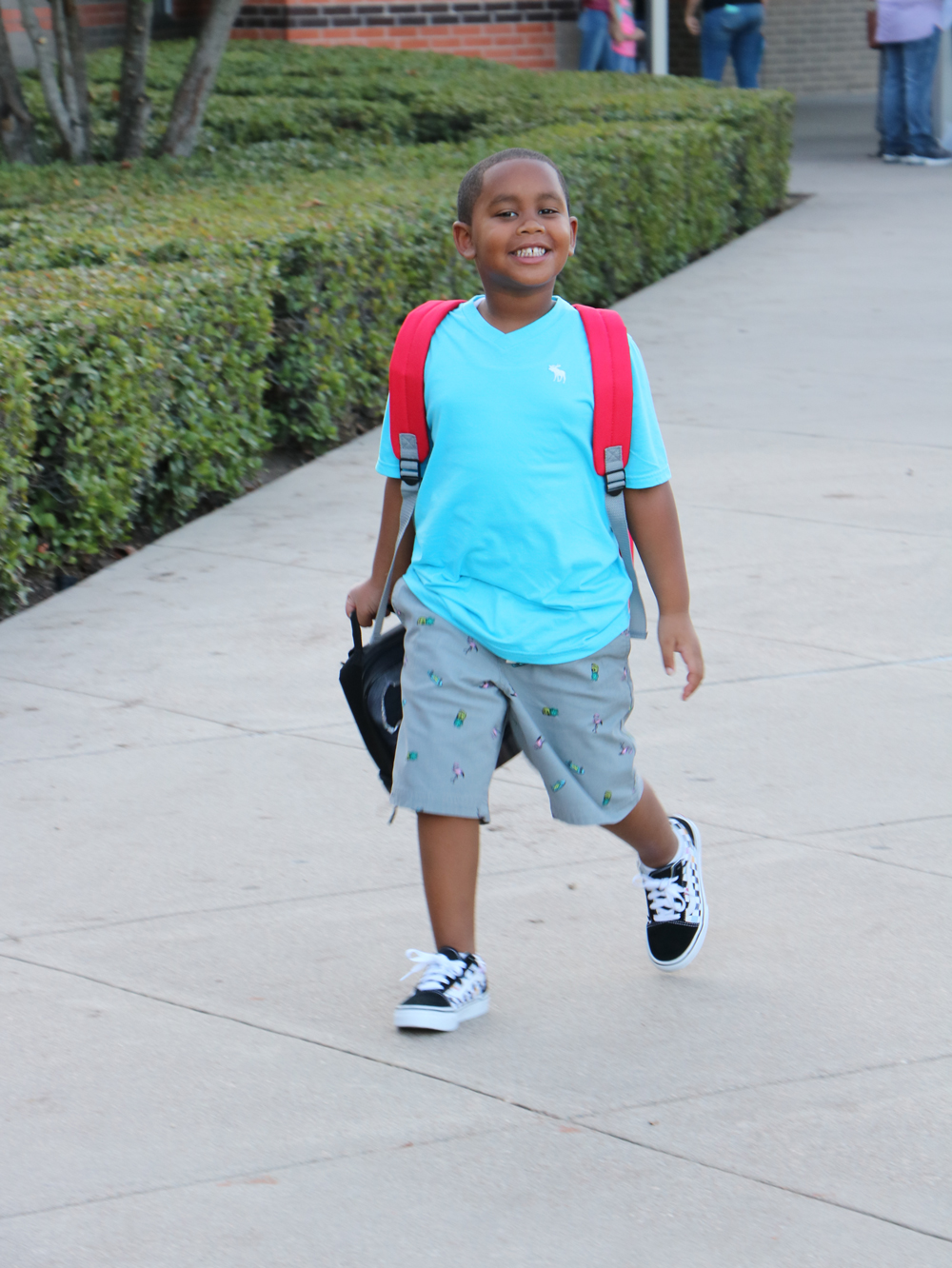 
Brycen Gardiner gets off the bus and heads into Travis Elementary for his first day of kindergarten.
