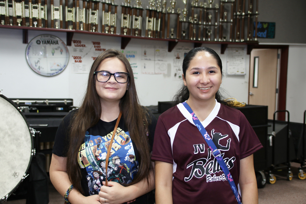 
Haylee Cobb (left) and Quessia Trujillo, freshmen at Robert E. Lee High School, wait in the Band Hall for the bell to ring on the first day of school.

