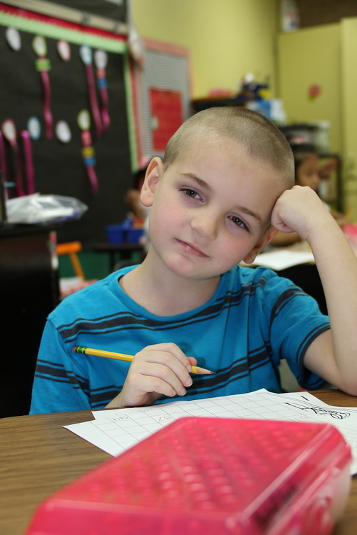 
Jesse High in Mrs. Homas’ first-grade class at San Jacinto Elementary, takes a break from his work.
