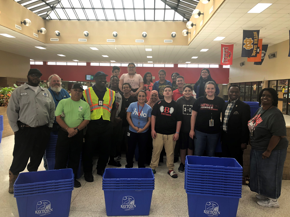 
Students and staff from Baytown Junior School, committed to the recycling program at BJS, along with city employees, Scott Sheley from Keep Baytown Beautiful and Charles Johnson, City Councilman, distribute the 80 recycling bins donated to the school by the City of Baytown. BJS’s Go Green Club meets monthly to discuss new initiatives and implement goals. Major projects include educating students about recycling and participating in recycling plastic and aluminum campus wide, joining the Crayola recycling program and planting 12 trees to be donated by ExxonMobil in the spring.

