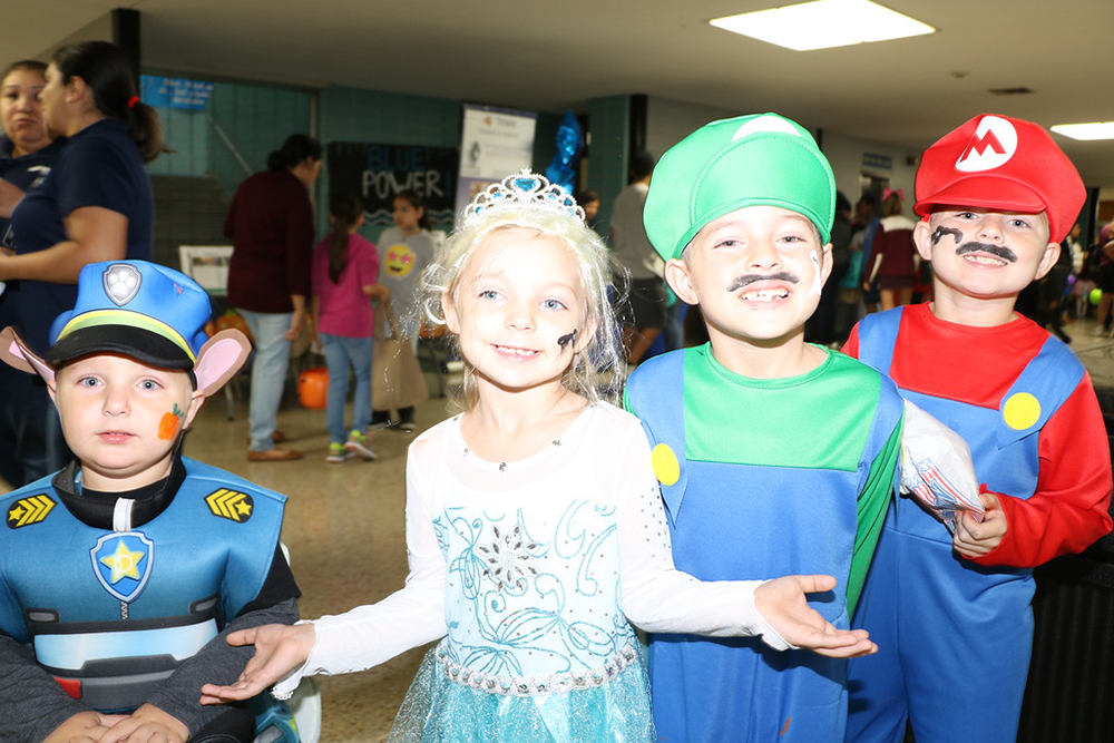 
Having fun at Goose Creek CISD’s Parent Resource Fair are (from left) Elijah Cromie, four-year-old; Alex Cromie, kindergartener; Josh Cromie, second-grader and Andrew Cromie, third-grader at San Jacinto Elementary. More than 50  vendors provided resources for 378 students  and parents, and children enjoyed trick or treating, a costume contest, food and door prizes at the event at Ross S. Sterling High School.  Harris Health System was on hand for flu shots and other immunizations.

