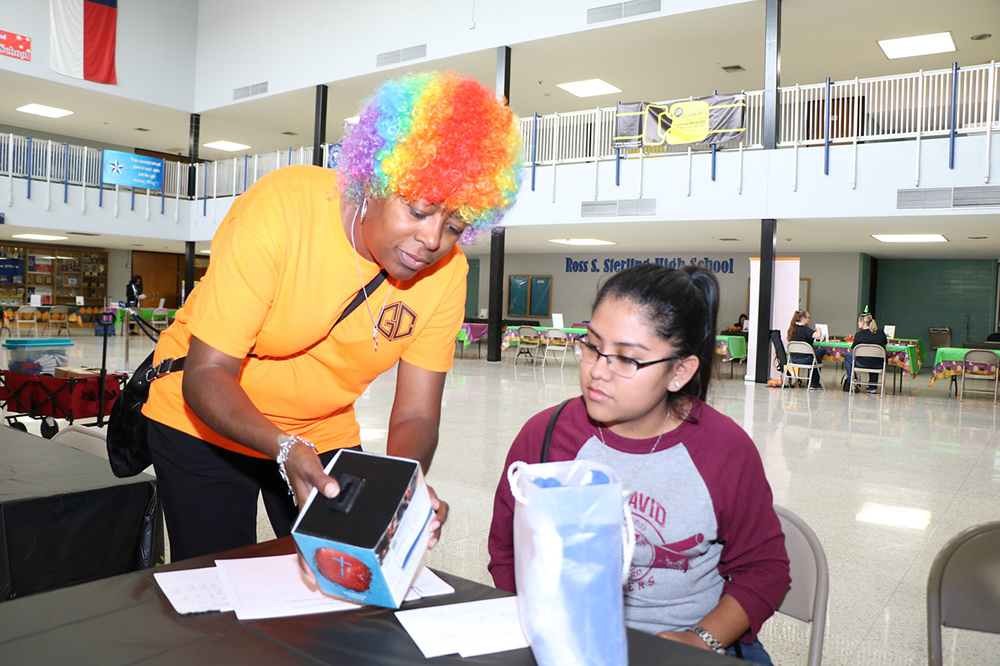 
Alice Ricks (left), counselor at POINT Alternative Center and coordinator of Goose Creek CISD’s Parent Resource Fair, and Julissa Trejo, a junior AVID student from Robert E. Lee High School, prepare door prizes for the drawing at the event. The event, which included more than 50 vendors,  drew in 378 students and parents.
