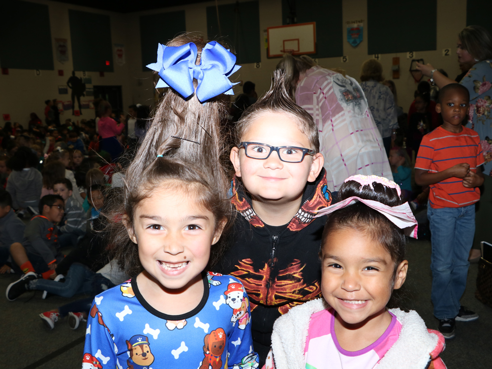 
Anielie Garcia (left), kindergarten, Kinsley Kay (right), kindergarten and Samuel Gordon, second grade, have fun with their crazy hair on Crazy Hair and Socks Day during Red Ribbon Week at Stephen F. Austin Elementary.
