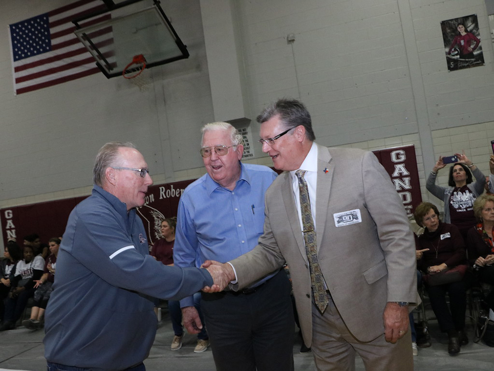 
Tim Finn (left), REL campus athletic coordinator and head football coach, meets Eddie Gray (middle), Class of 1953 and Councilman Bob Hoskins, Class of 1976.
