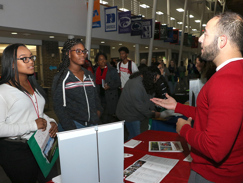 
Goose Creek Memorial High School students (from left) Trystan Johnson and Breanna Shelton get some helpful tips about college and Goose Creek CISD’s College Night from Joshua Perrodin with the University of Louisiana.
