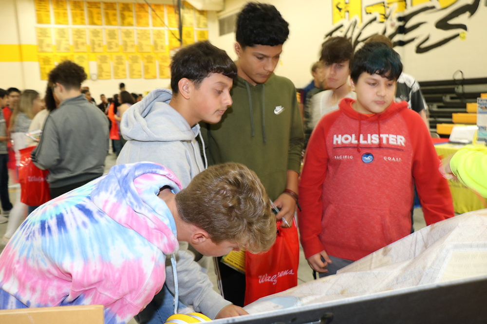 
Highlands Junior School eighth-graders (from left) Vernon Duke, Saul Chavez, Alan Urenda, Alexander Hebrank and Christopher Hernandez look at a map at the Texas Department of Transportation booth at the Third Annual Highlands Junior School College and Career Fair. The event is to promote College and Career Week and to match college and careers to the various endorsements so that students can make informed decisions on endorsements before the end of the semester.
