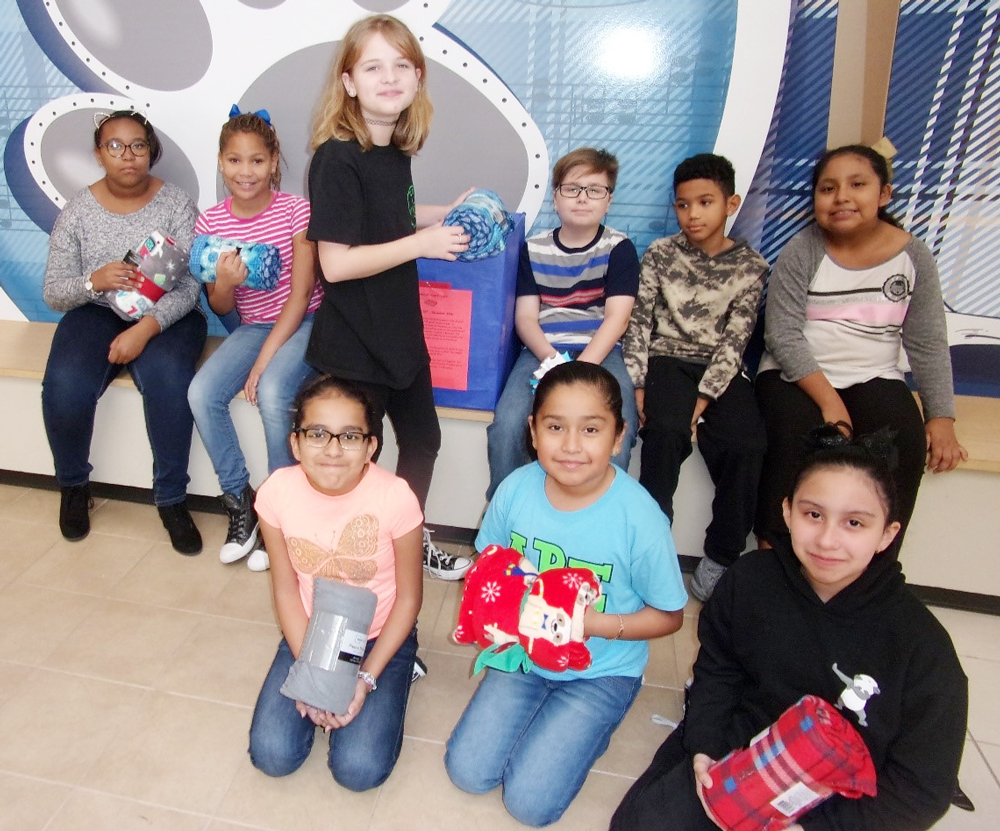 
Students at Dr. Antonio Bañuelos Elementary display some of the small lap blankets they are collecting for their Blanket Project. PIctured are (front, from left) Krystal Murillo, Valeria Reyna, Daniela Chapa, (back, from left) Sydni Godfrey, Autymn Alfred, Savannah Prickett, Cooper Moore, Myles Reimonenq and Nayela Trejo.
