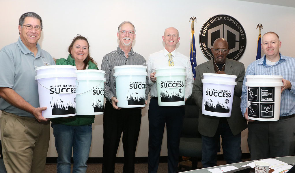 
Members of the Goose Creek CISD board of trustees receive camping bucket lights at a recent board meeting in honor of School Board Recognition Month.
