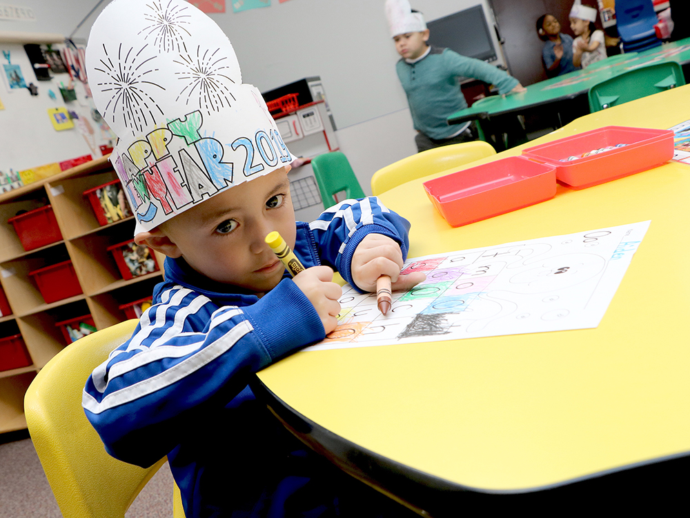 
Aiden Herrera from Ginger Mendisabol’s morning pre-kindergarten class at Victoria Walker Elementary is happy to start the new year with a coloring assignment.
