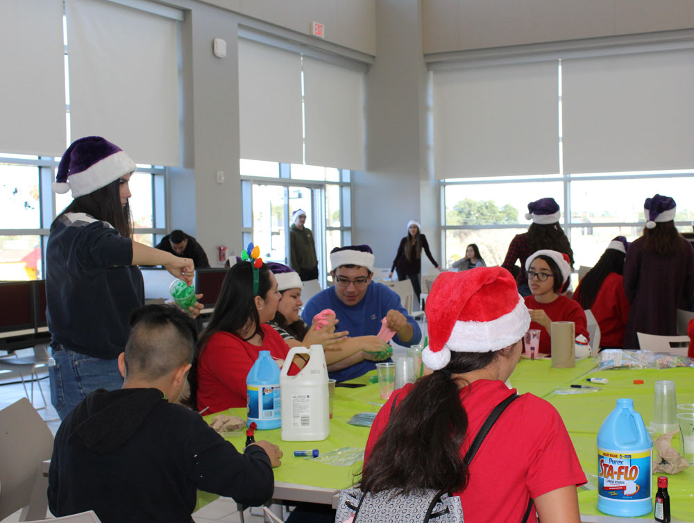 students prepare gifts at table