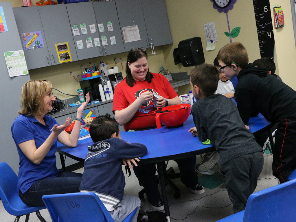 
Nicole Stalkfleet (back) and her students at Ashbel Smith Elementary decide if the Squeebie Mixing Bowl.

