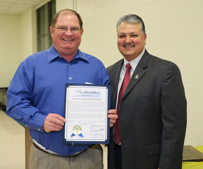 
Baytown Mayor Brandon Capetillo (right) presents a proclamation to Randy Casey, Baytown Crime Stoppers Board chair, designating January 2019 as Baytown Crime Stoppers Month in Baytown.
