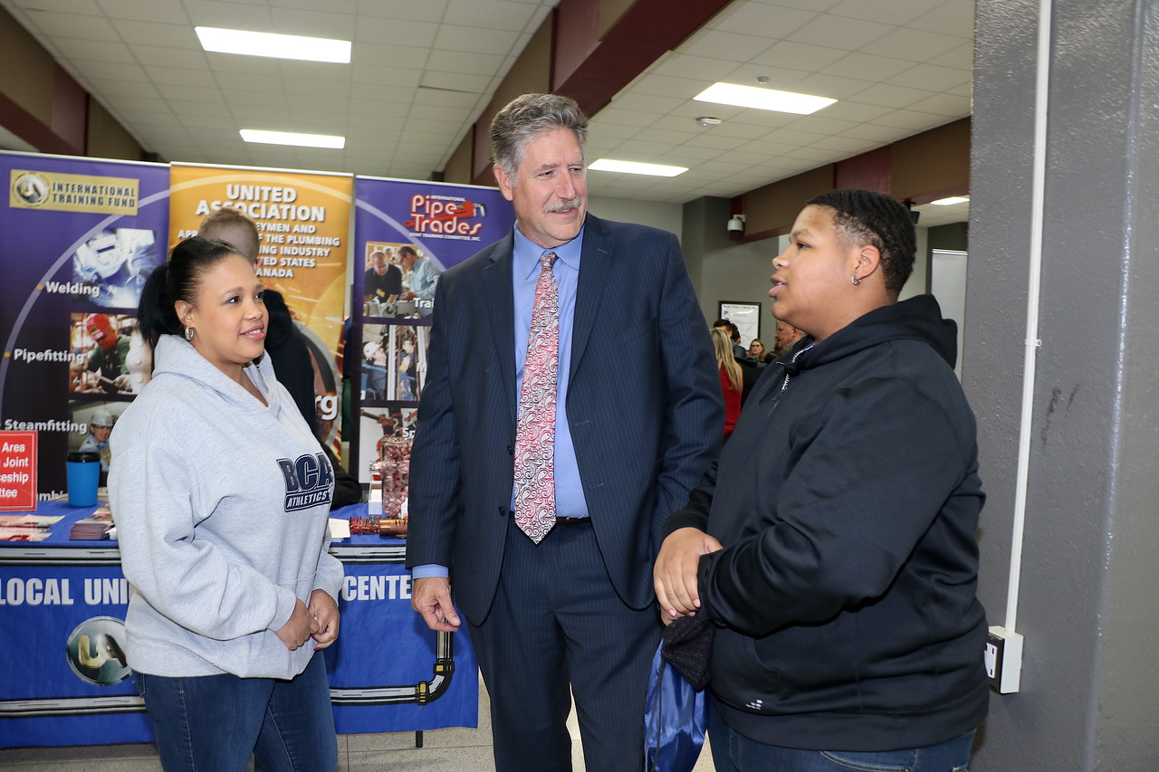 
Ja’Vaughn Gillum (right), a senior at Goose Creek Memorial High School, and his mother Dawn Chavis talk to Randal O’Brien, Goose Creek CISD superintendent, about post-secondary options at Goose Creek CISD’s recent 7th Annual Career Night at Robert E. Lee High School.
