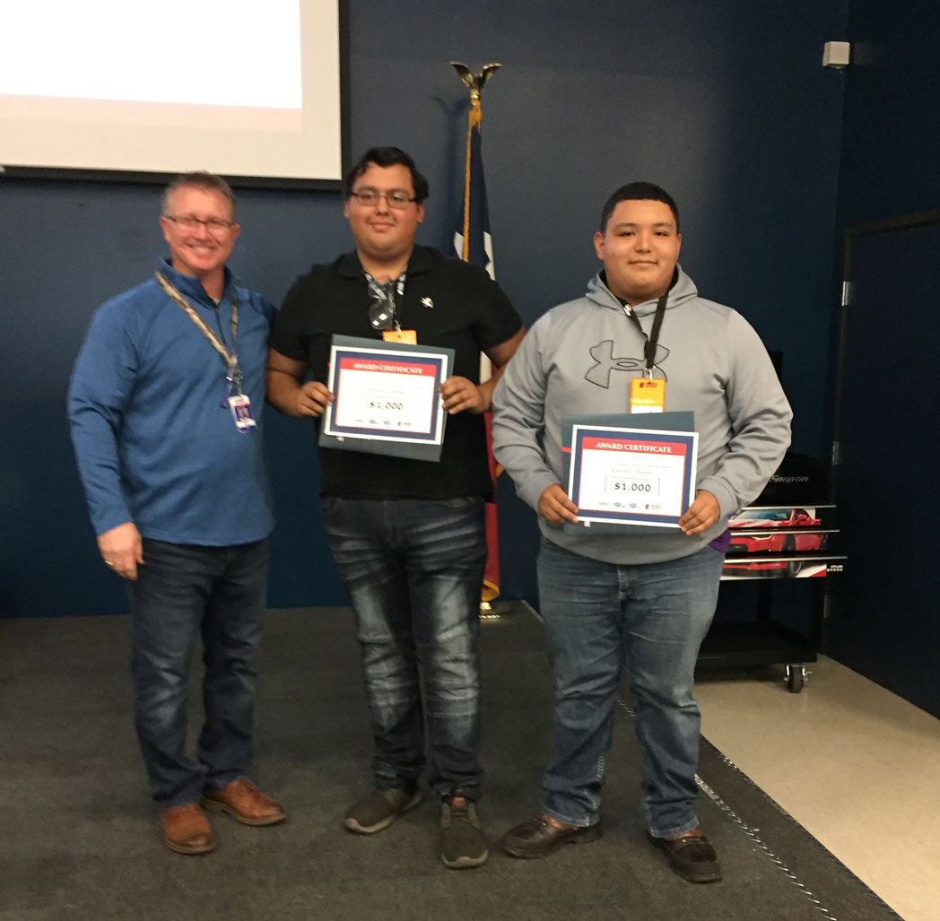 
Darrin Brust (left), Universal Technical Institute – Houston president, congratulates Stuart Career Tech High School students Alvaro Chavez (middle) and Juan Hinojosa on winning $1,000 scholarships to UTI at the recent Top Tech Challenge.
