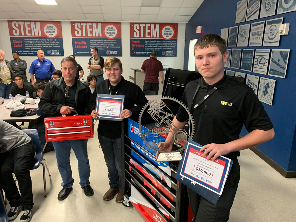 
Jim Ornelas (left), Stuart Career Tech High School diesel/auto tech instructor, congratulates two Barbers Hill High School students (from left) Austin Grothe and Cameron Cramer, who are in the SCTHS automotive program after school, on winning $10,000 scholarships to Universal Technical Institute in the recent Top Tech Challenge. SCTHS was presented with a trophy and a tool box.
