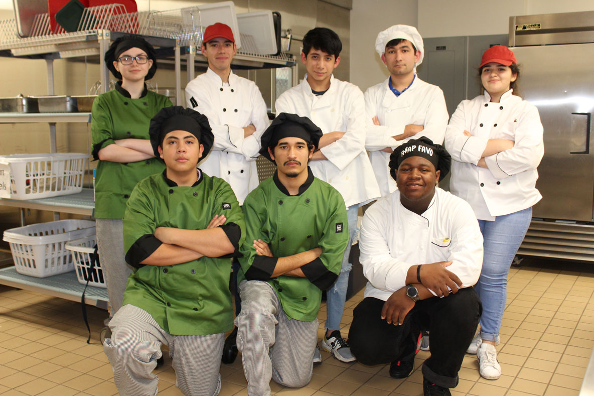 
Three teams prepare to compete in Aramark’s annual Lone Star Chef Competition. Students are (front, from left) Alejandro Alcantar and Nathan Garza from Stuart Career Tech High School (SCTHS); Favyon Russell from Robert E. Lee High School (REL); (back, from left) Destiny Whitener from SCTHS; Angel Palos from REL; Jason Buruca and Joseph Coy from Ross S. Sterling High School and Kaitlyn Ruiz from REL.

