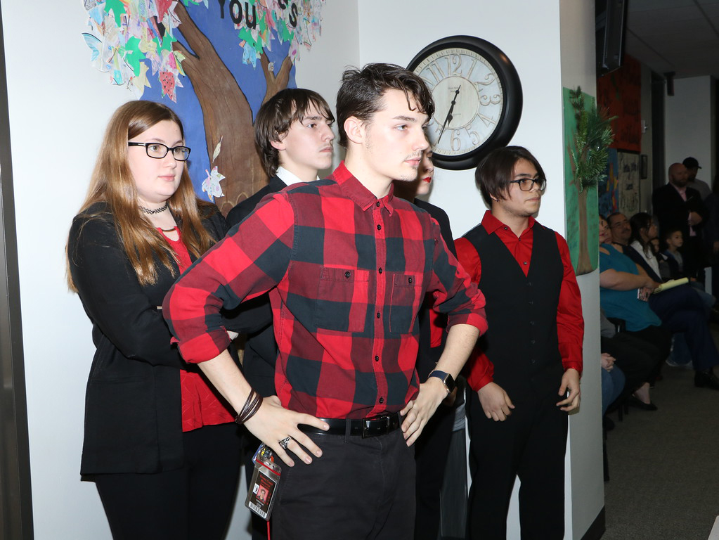 
four Goose Creek Memorial High School students perform at the district administration building
