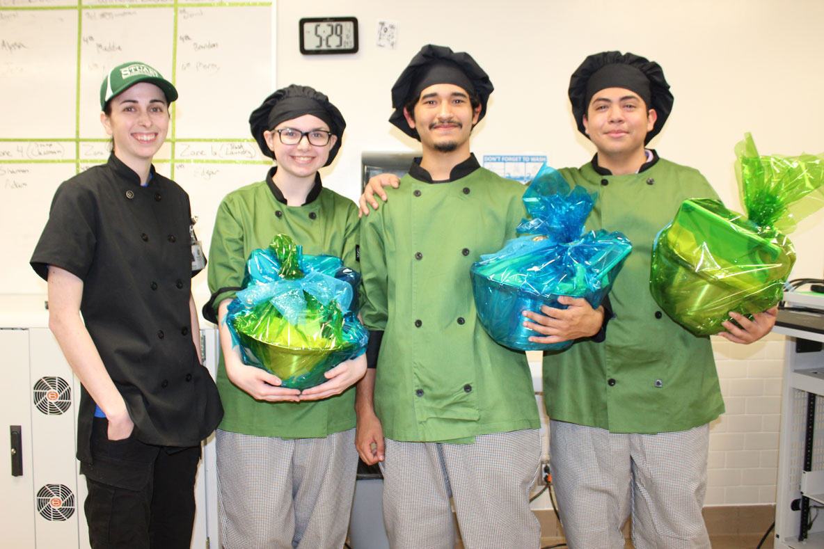
Chef Kylie Sobczak (left) from Stuart Career Tech High School, congratulates her winning team (from left) Destiny Whitener, Nathan Garza and Alejandro Alcantar. The SCTHS team won the district Lone Star Chef Competition with “Nathan’s Crunch Wrap” and will represent Goose Creek CISD at the state competition in March.
