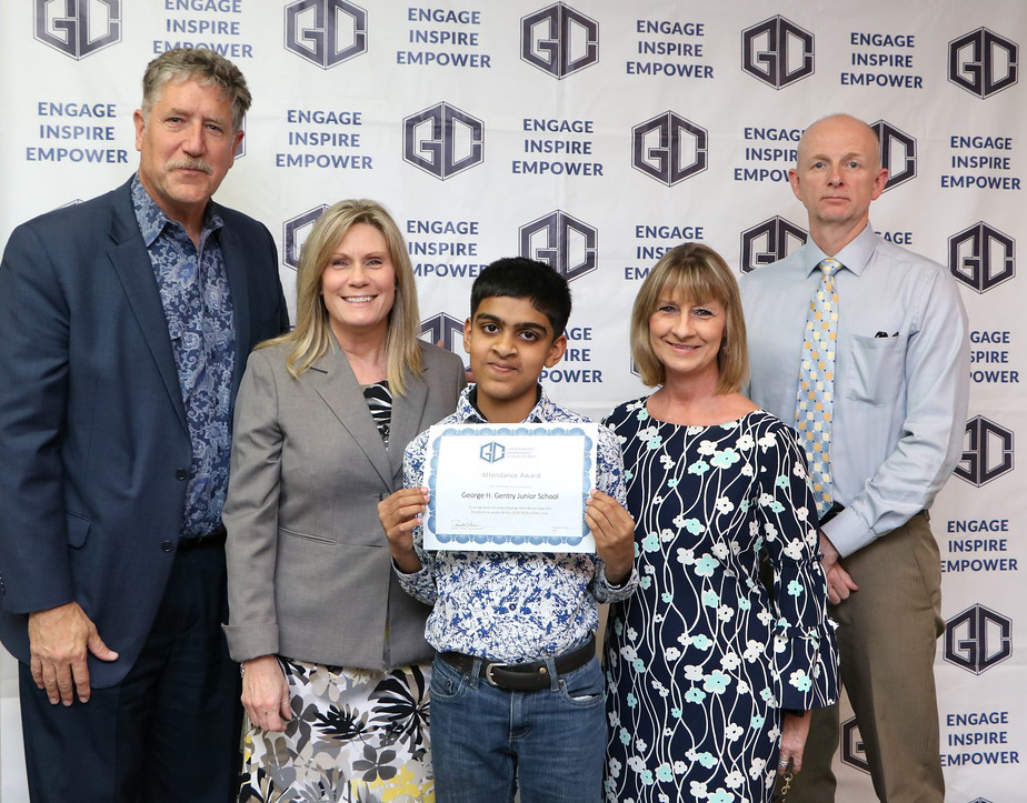 
Gentry Junior School is recognized at a recent meeting of the Goose Creek CISD board of trustees as the junior school with the top attendance rate, 95.96 percent, for the third six weeks. Pictured are (from left) Dr. Randal O’Brien, Goose Creek CISD superintendent; Kathy Holland, Gentry principal; Godwin Benny, sixth-grader; Shelli Edwards, attendance clerk and Pete Pape, president of the Goose Creek CISD board.
