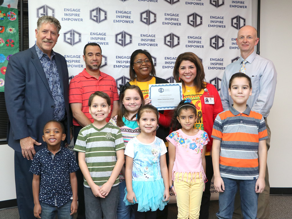 
Harlem Elementary receives an award for being in the top three elementary schools with an attendance rate of 96.21 percent for the third six weeks. Pictured are (front, from left) Amere Stevenson; Fernando Magallon; Mikenzie Legault; Camila Magallon; Nagwa Abdelghany; Luis Magallon; (back, from left) Dr. Randal O’Brien, Goose Creek CISD superintendent; Michael Garza, campus student success specialist; Nawase’ Sherman, assistant principal; Betty Baca, principal and Pete Pape, president of the Goose Creek CISD board of trustees.
