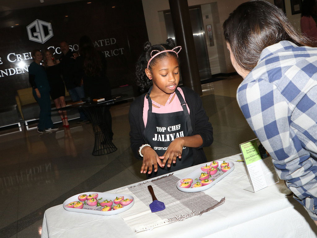 
Jaliyah Riddick-Grant, a fifth-grader from Victoria Walker Elementary, tells how she made her award-winning Beet Pickled Devilish Eggs for Franchesca’s Friends: Farm Fresh Texas Produce Recipe Contest. The students shared their creations before the recent meeting of the Goose Creek CISD board of trustees. The competition was organized by Chef Franchesca Bland from the Goose Creek CISD Nutrition Services Department.
