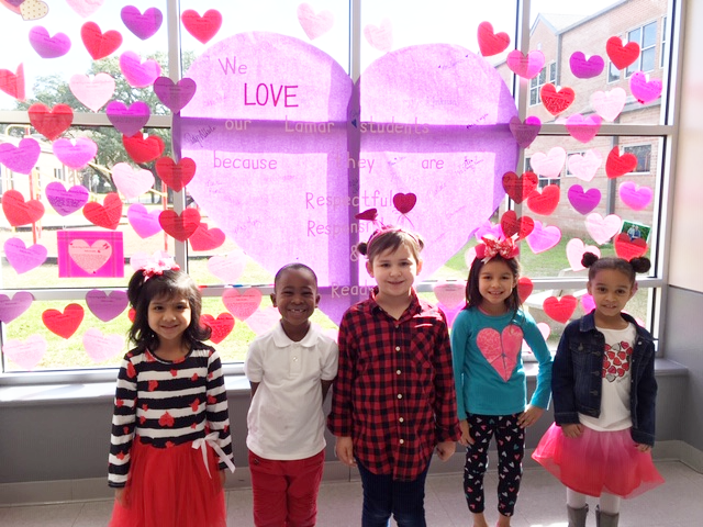 
Lamar Elementary students took paper hearts home bearing the message “I Love My Child Because . . .” for parents to complete and send back. Teachers signed the large heart with reasons they love their students. Enjoying the Valentine’s Day Wall are kindergarten students (from left) Sophia Atrian, Quincy Jones, Sara Konczal, Lia Luna and Kali Brooks.
