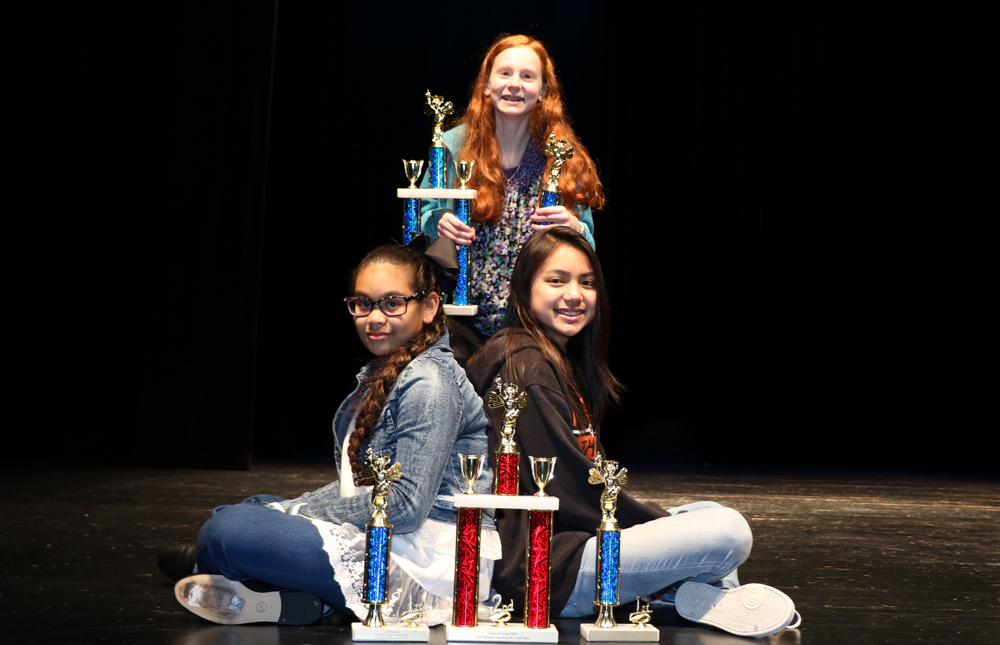 
Hanna Coker (top), seventh-grader at Cedar Bayou Junior School, won the Goose Creek CISD District Spelling Bee after 19 rounds by spelling the word psalm correctly. Laila Cardona (left) , fifth-grader at Bowie Elementary, and Mariah Ondap, seventh-grader at Gentry Junior School, both missed a word in the same round, so they tied for 2nd place. Twenty spellers competed spelling bee, held at Cedar Bayou Junior School.
