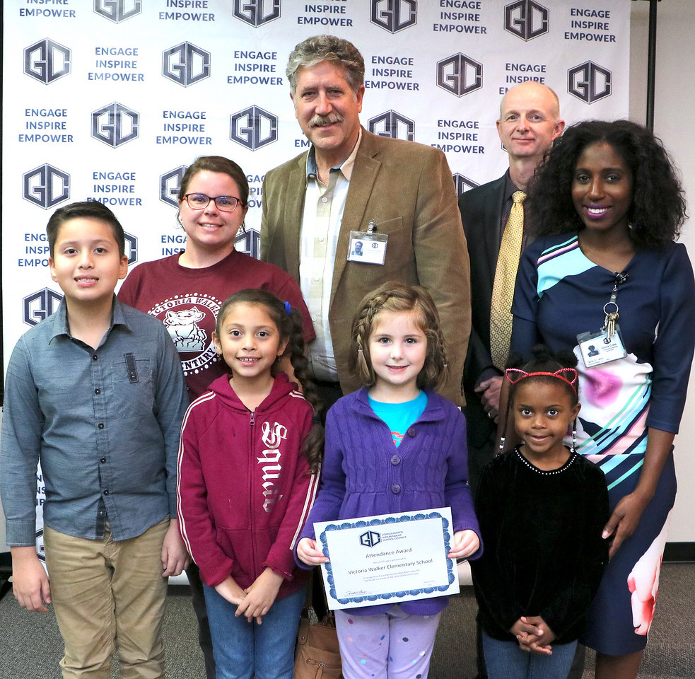 
Victoria Walker Elementary receives an Attendance Award for having the third highest attendance rate, 95.85 percent, for GCCISD elementary schools for the fourth six weeks. Dr. Randal O’Brien (back left), GCCISD superintendent, and Pete Pape (back right), GCCISD board president, present the award to (front, from left) Olivia Reid, Kylie Jimmerson, Osmanny Perez, Alisson Perez, (middle, from left) teacher Elizabeth Eagle and Student Support Administrator Tailis Oniwon at a recent meeting of the GCCISD board of trustees.
