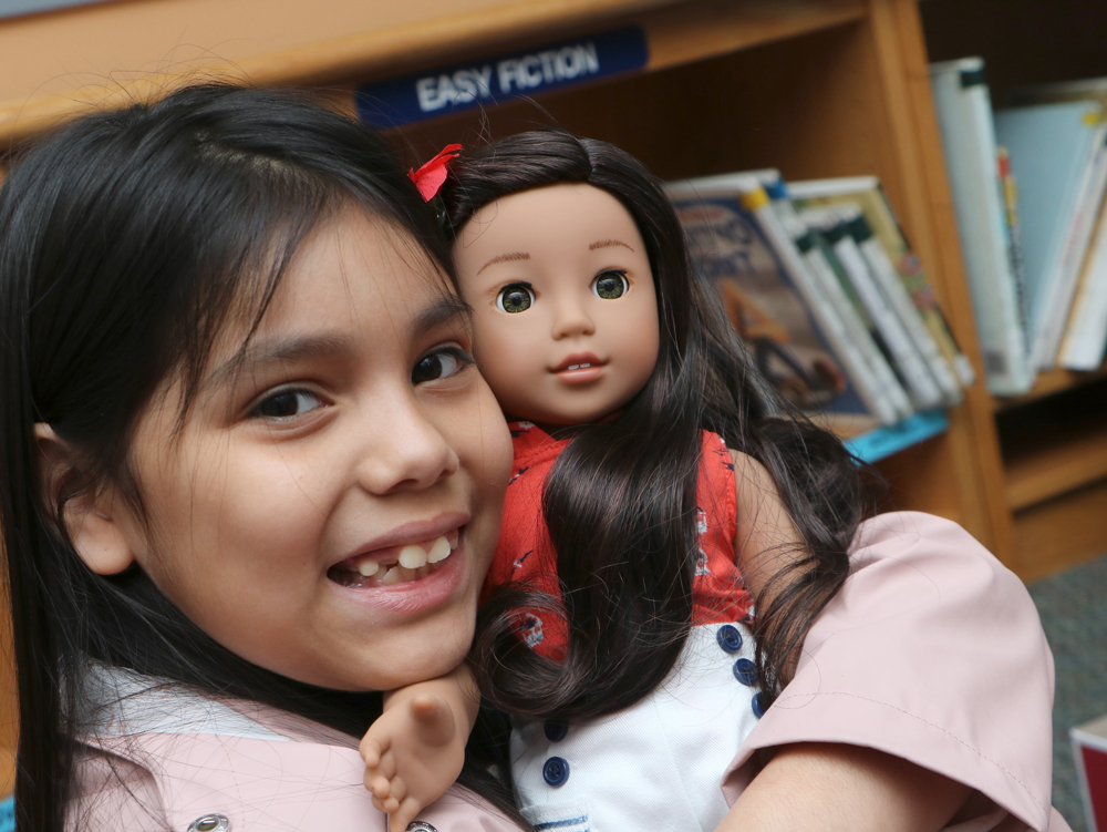 
Cecilia Bruno hugs her new doll from Dolls4All.
