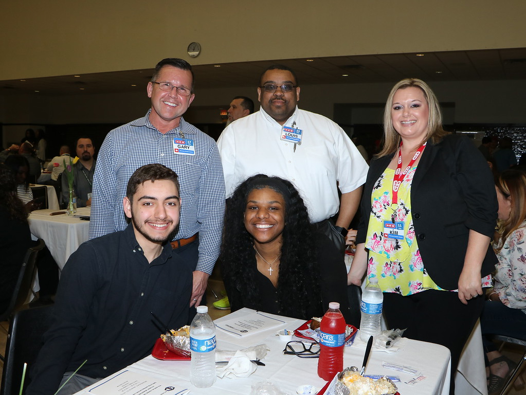 
HEB student employees (front, from left) Brendan Henderson from Goose Creek Memorial High School and Janessa Carbon from Ross S. Sterling High School enjoy the Student Workforce Connection Employee Appreciation Luncheon with their employers (top, from left) Gary Schmalfeldt, unit director; Louis Reese, service director and Kim Kelly, community coordinator.
