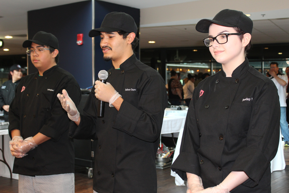 
The Goose Creek CISD Culinary Arts team of (from left) Alejandro Alcantar, Nathan Garza and Destiny Whitener present to the judges during Aramark’s 2019 Lone Star Chef state contest at Minute Maid Park. They walked away with the first-place trophy and $2,500 in scholarship money for their creation, “Nathan’s Crunch Wrap.” Chef Kylie Sobczak from Stuart Career Tech High School coached the students.
