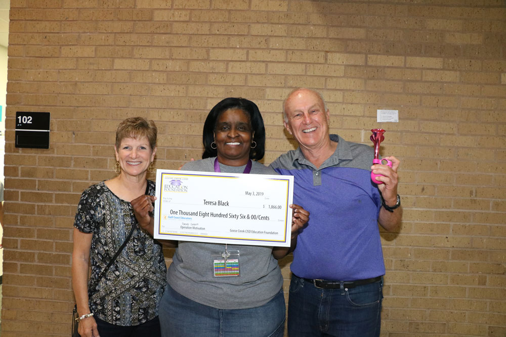 
Baytown Junior School teacher Teresa Black (middle) is awarded a group grant in the amount of $1,866 for “Operation Motivation” by Ginger Burnside (left) and RD Burnside, Goose Creek CISD Education Foundation donors.
