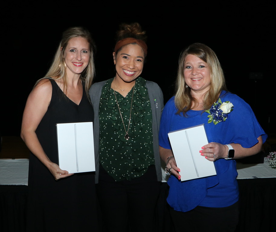 
Kristen Curette (middle) from Community Resource Credit Union, presents iPads to Goose Creek CISD Teachers of the Year Angie Johnson (left) from Goose Creek Memorial High School and Anna West from Victoria Walker Elementary.
