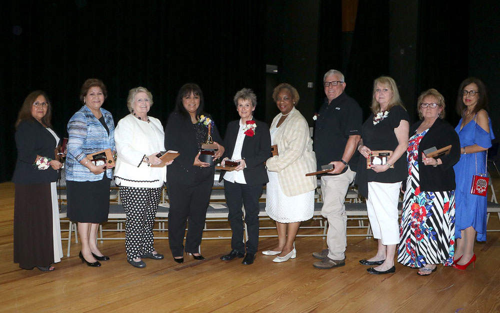 
Eva Padilla, Sally Capetillo, Karen Coffey, Terry Coy, Debbie Crow, Valery Jackson, Darrell Kalbitz, Connie Piotrowski, Sharon Stults and Catherine Huntley receive plaques and clocks in honor of their retirement. Not pictured is Michelle DuBay.
