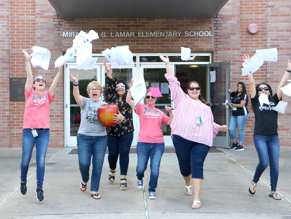 
Lamar Elementary teachers (from left) Jessica Robinson, Joy Powers, Daisy Villatoro, Sunnye Hickman, Elisa Berger, Mirna Espinoza and Magaly Bajar (holding the door)
celebrate the last day of the 2018-2019 school year.
