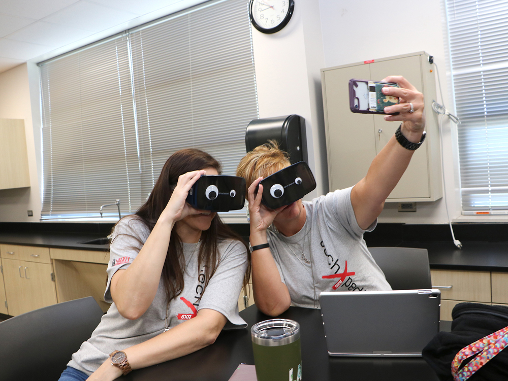 
Lauren Mercer (left) and Lisa Gauthreaux, technology integration specialists, enjoy an augmented reality session using the Google Expeditions app, exploring distance locales in virtual reality and tiny structures in augmented reality.
