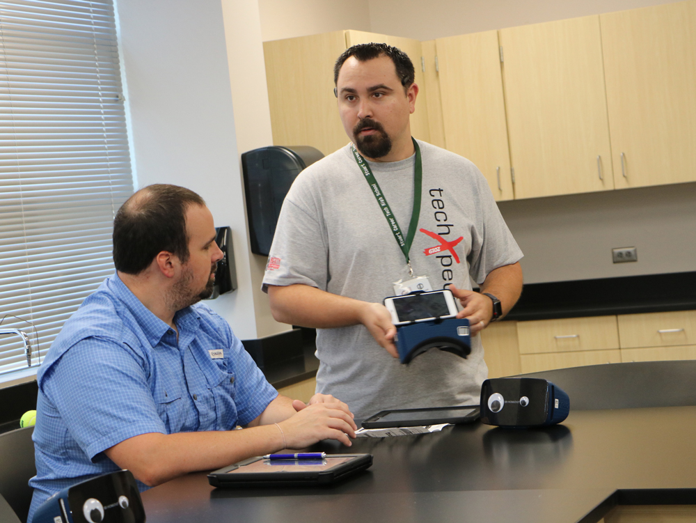 
Andrew Willis and Ian Sobczak from Stuart Career Tech High School discuss the virtual reality goggles which allowed them to ”visit” a space station during the recent techXpedition sessions, hosted by the GCCISD Educational Technology Department for teachers and librarians.
