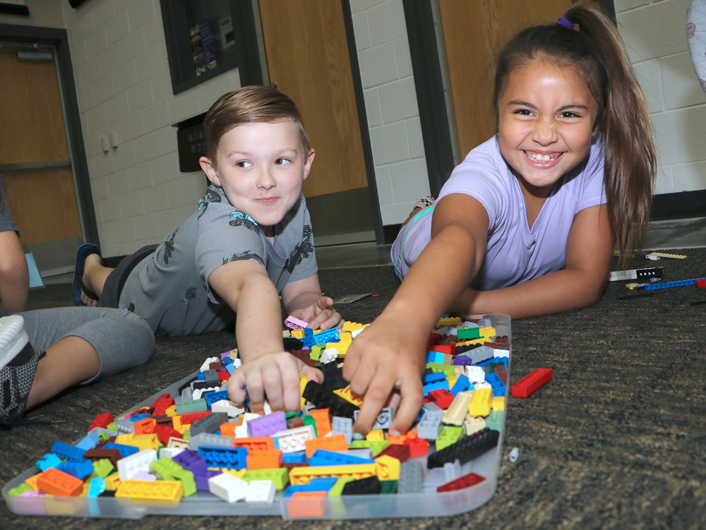 
Braxton Davis (left) from Crockett Elementary and Mary Catherine Arias from Alamo Elementary choose Legos for their project during Goose Creek CISD’s Lego Camp.

