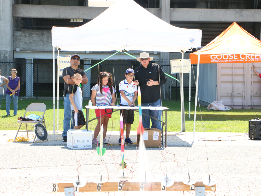 
Guillermo Najera (left), teacher at Ashbel Smith Elementary, watches Rocketeer Camp students (from left) Beau Turner, Leah Clifford and Jeikobs Mercado prepare to launch the rockets they built at Goose Creek CISD’s Rocketeer Camp. Also pictured is instructor Ricky Moore.
