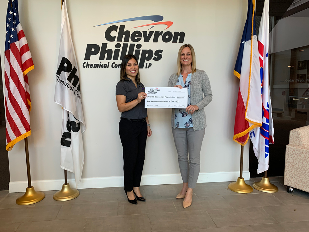 
Heather Betancourth (right), community and government relations representative at Chevron Phillips, presents a check for $10,000 to Erika Foster, GCCISD Education Foundation director, for the company’s All-Star sponsorship of the Education Foundation’s All-Star Gala September 14, 2019, at Minute Maid Park. Chevron Phillips is a longtime supporter of Goose Creek CISD students, staff and schools.
