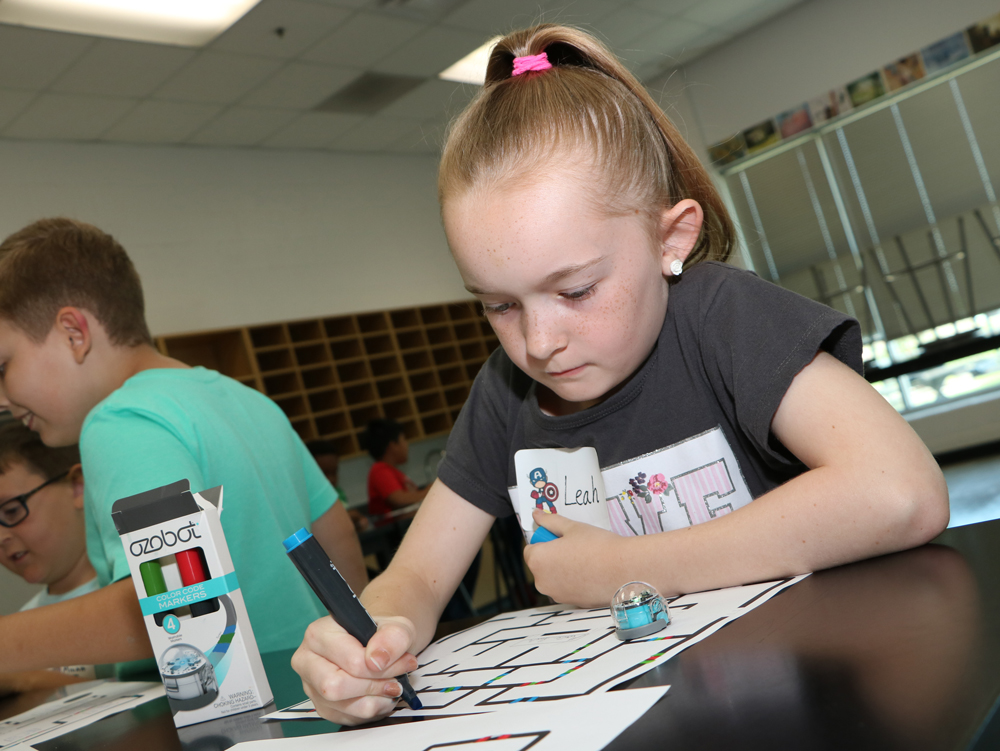 
Leah Pape from Victoria Walker Elementary works on a coding project for the Ozobot at Goose Creek CISD’s Summer Coding Camp.
