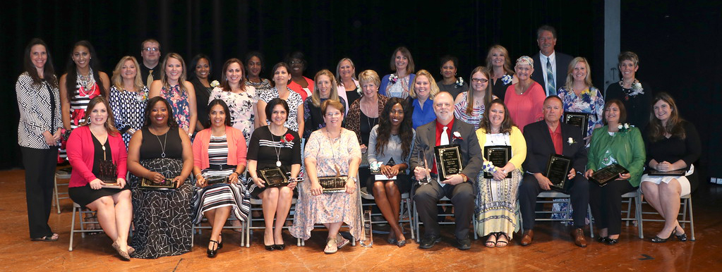 Teachers from all campuses pose for photo for Teacher of the Year