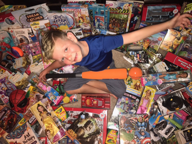 F Lane Rex, surrounded by toys donated by Goose Creek Memorial High School AVID students and their teacher Misty Dolgner, is happy that his birthday wish to fill the toy closet at Texas Children’s Hospital is coming true.
