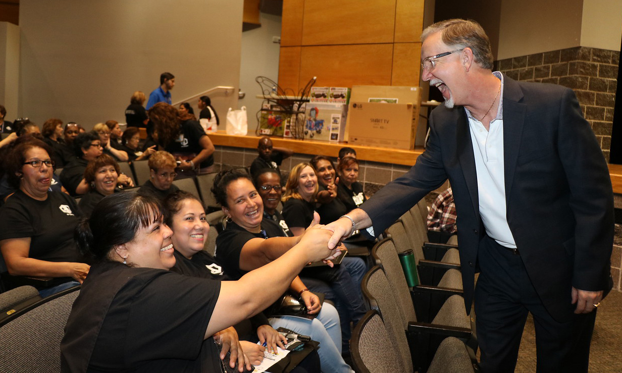 Richard Clem, member of the Goose Creek CISD Board of Trustees, shares in the fun with employees at the Goose Creek CISD Administrative Services Convocation. The event featured the Lee High School Drumline, messages from Randal O’Brien, superintendent and Dr. Anthony Price, deputy superintendent of administrative services, door prizes, lunch and training for the 2017-18 school year.