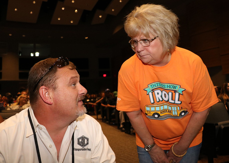  Rick Walterscheid, director of transportation and special projects for Goose Creek CISD, talks with bus driver Jan Bracey at the recent Administrative Services Convocation.
At the event, employees were greeted by the Robert E. Lee Drumline, and Dr. Anthony Price, deputy superintendent for administrative services, presented the message, “A Positive Me, A Positive You.”
After door prizes and lunch, employees participated in training for the upcoming school year.