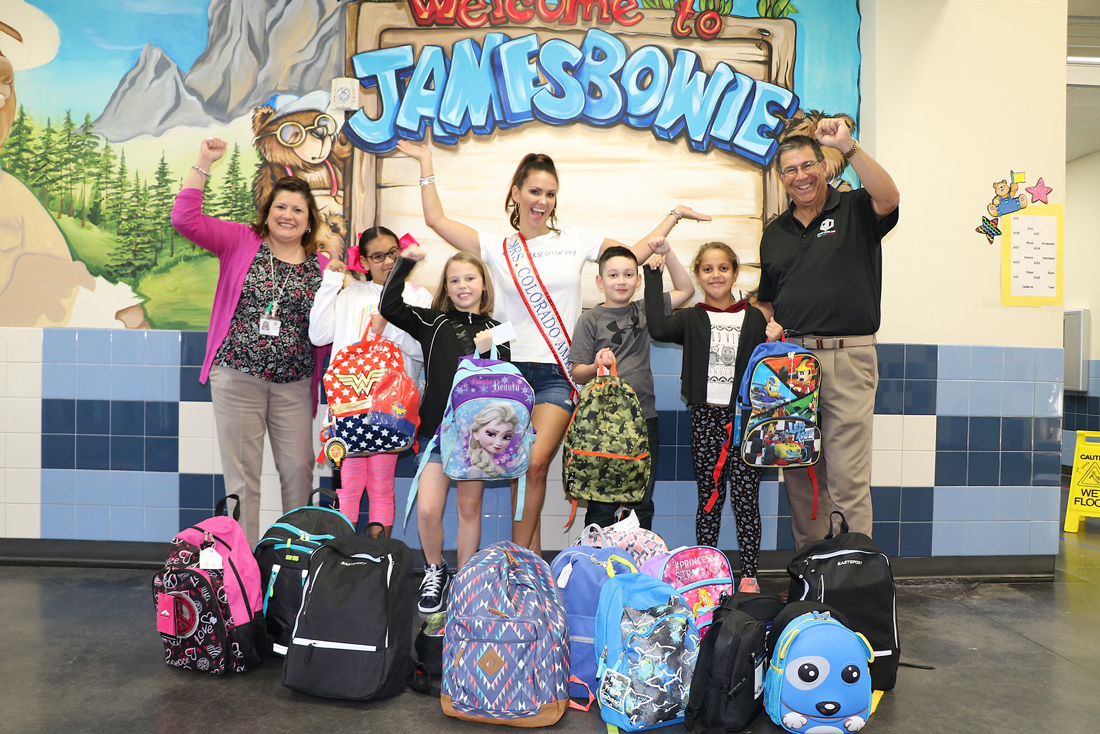  Mrs. Colorado Valerie Daly delivers backpacks to Bowie Elementary with Al Richard (right), Kiwanian and Goose Creek CISD board president. Also pictured are (from left) Blanca Capetillo, principal; Laila Cardona; Ciara Keene; David Benavides and Ydalia Curiel, all fourth graders. The Mrs. America USA organization donated backpacks and supplies to GCCISD schools for students affected by Hurricane Harvey, and several contestants, representing their states, came in to distribute them. 