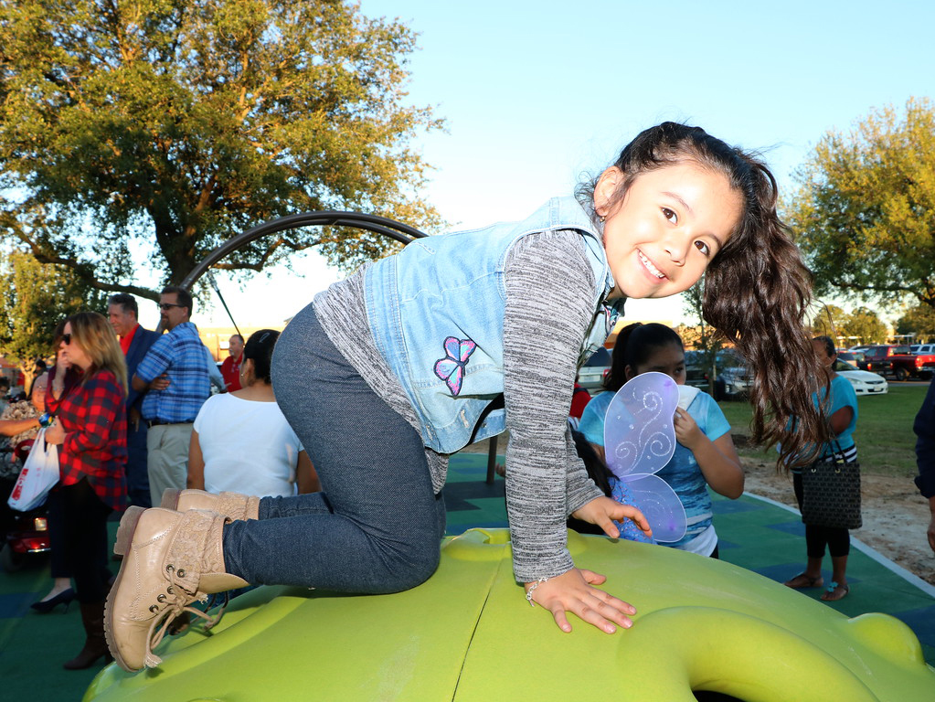 Amber Rico climbs on the new playground equipment at the ribbon cutting of the William B. Travis Park Inclusive Playground. Featuring equipment adapted so that special needs children can also enjoy the park, the playground was constructed through the efforts of the City of Baytown, Goose Creek CISD, Rotary Club of Baytown and Kiwanis Club of Baytown.
